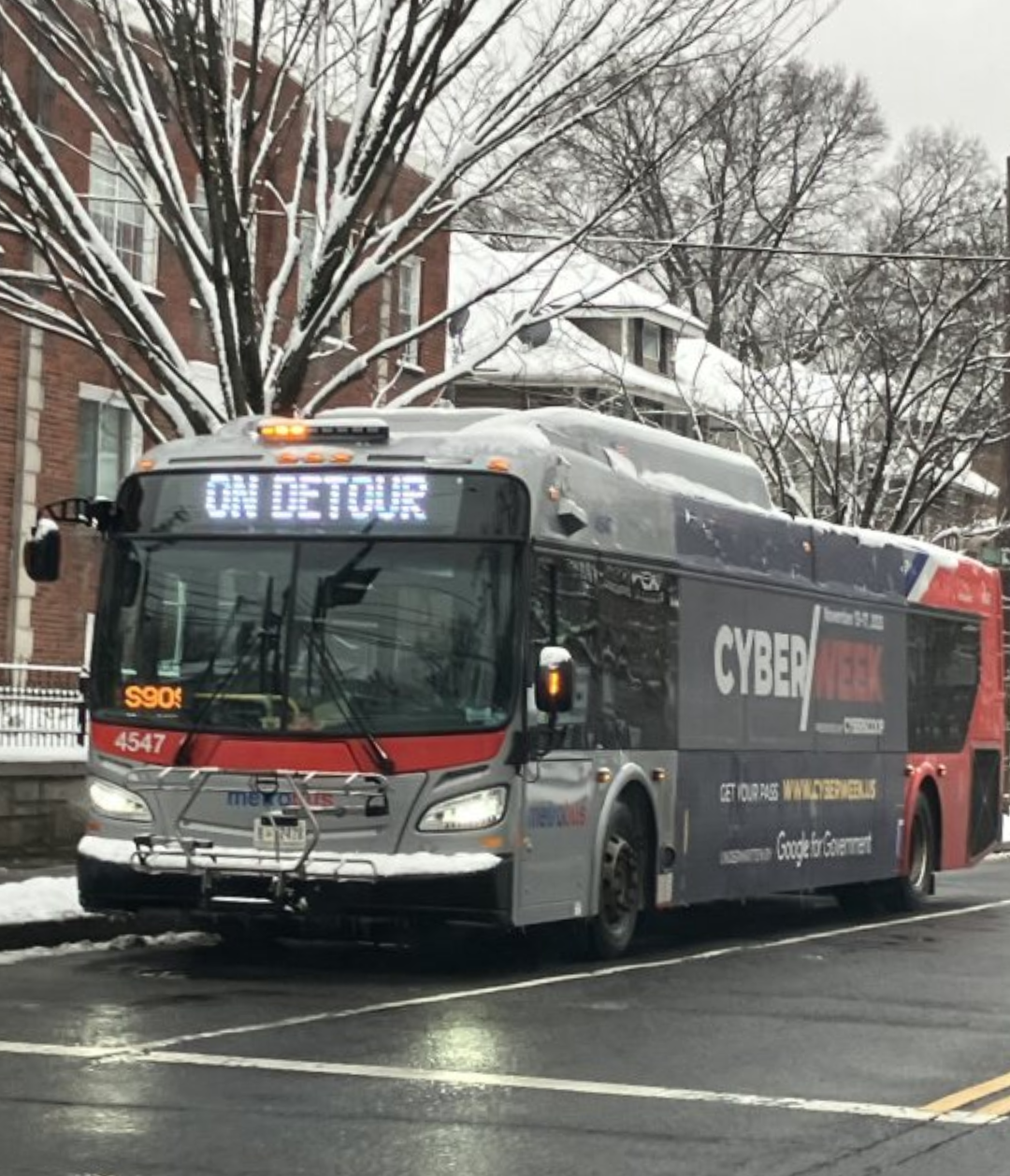 bus on wet, snowy street