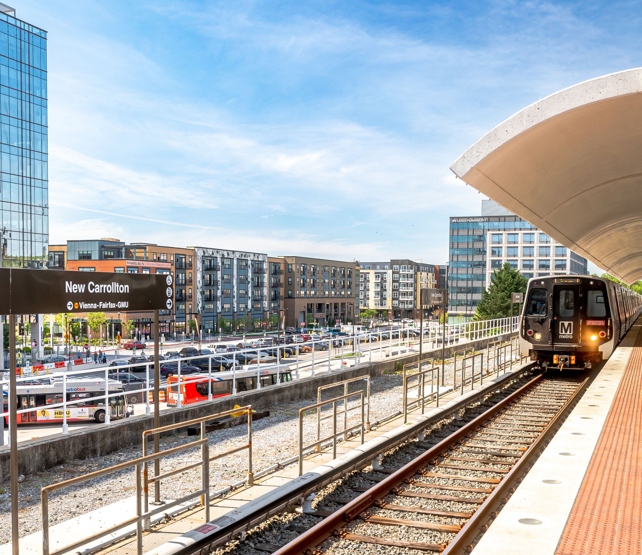 Train arriving at New Carrollton station with new development in the background
