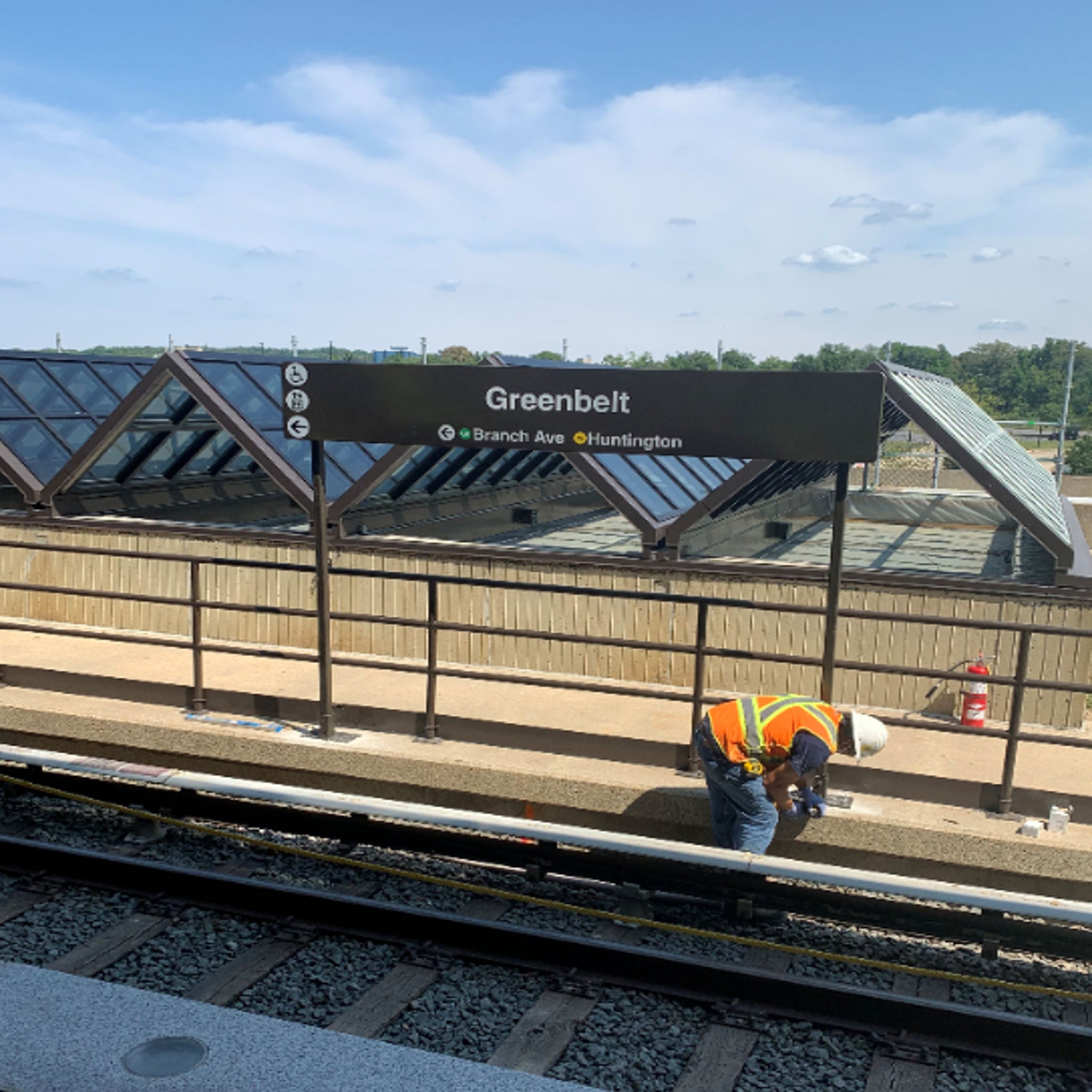 Greenbelt installing station signage