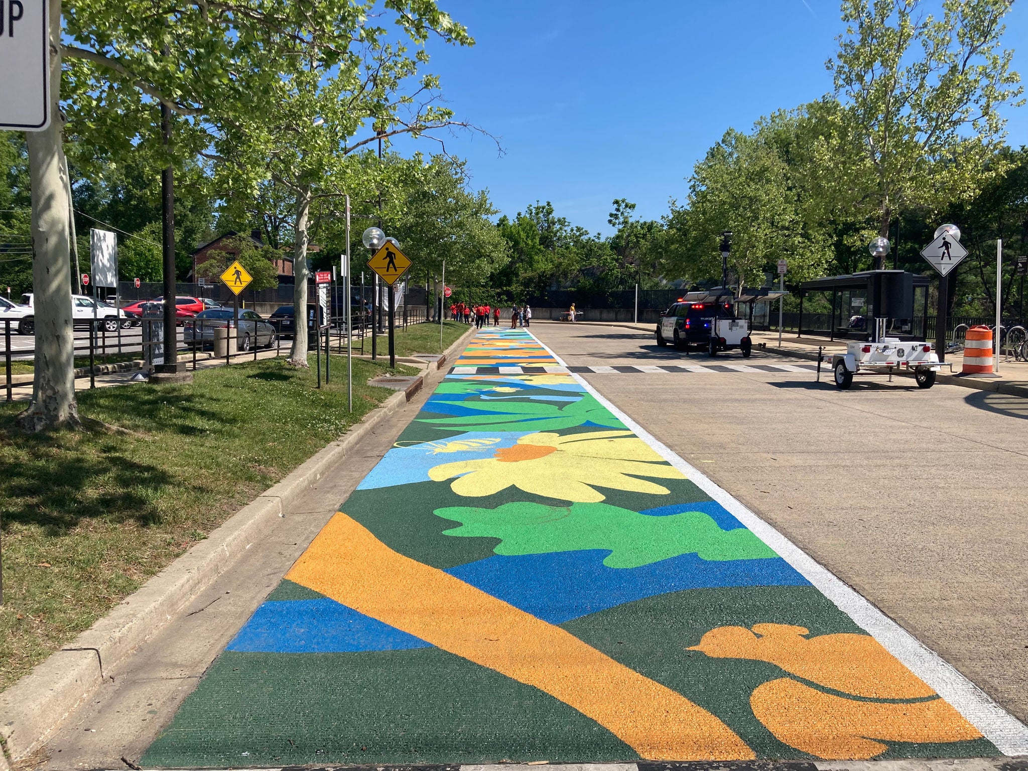 College Park: A Great Place to Bee  is an exciting colorful mural that offers a vibrant  moment to reflect on the many forms of travel, history, and environmental richness that shape College Park, Maryland.