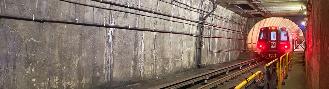 Red line train in tunnel.
