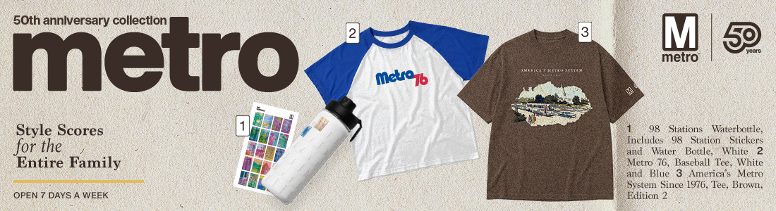 Metro's 50th anniversary pop up shop. Image has a brown ball cap with 'ask me about metro' stitched on the front. a red quarter zip, and a brown shirt that say's 'America's Metro'