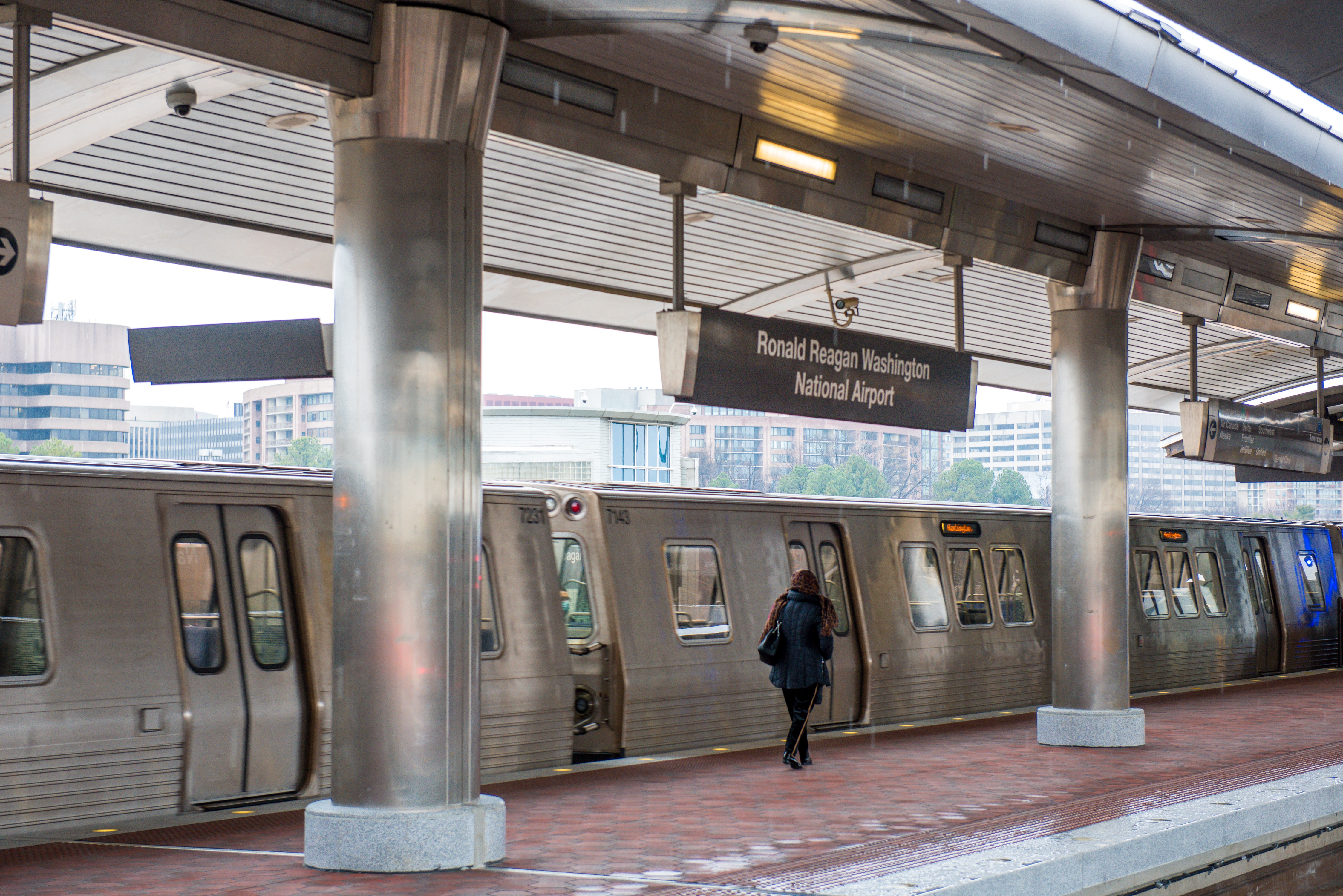 Customer walking on new slip-resistant tiles at Reagan National Airport Station