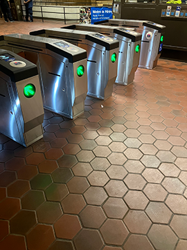A picture of the faregates at the exit that leads to the street elevator for 7th Street and Maryland Avenue. The ADA faregate is furthest to the right in this picture.