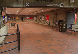 A picture of the mezzanine after the faregates. The guide rail on the left will lead to the correct path and then will end.