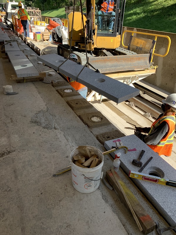 Granite installation underway at Addison Rd platform